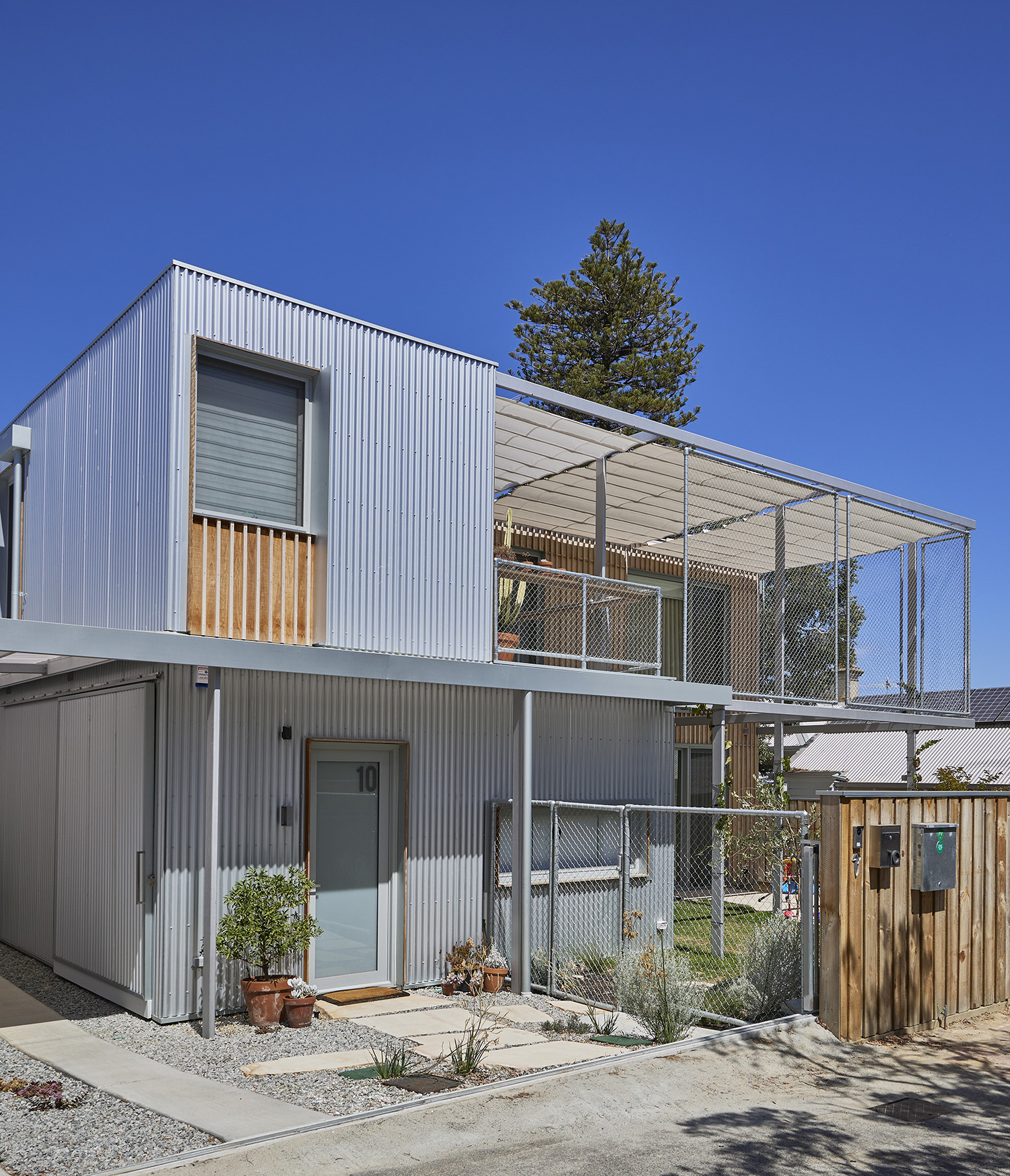 exterior of a multi storey home with cable shades installed